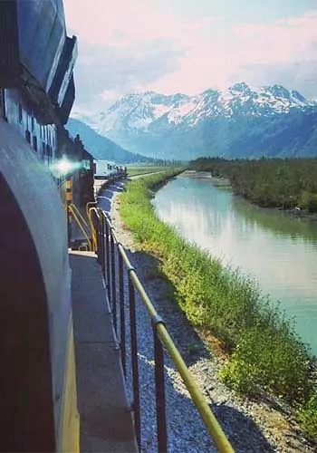 Alaska railroad heading through the mountains toward Spencer Glacier