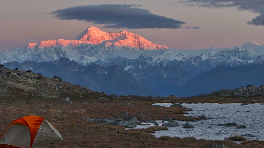 Denali at sunrise from Kesugi Ridge with backpacking tent in foreground