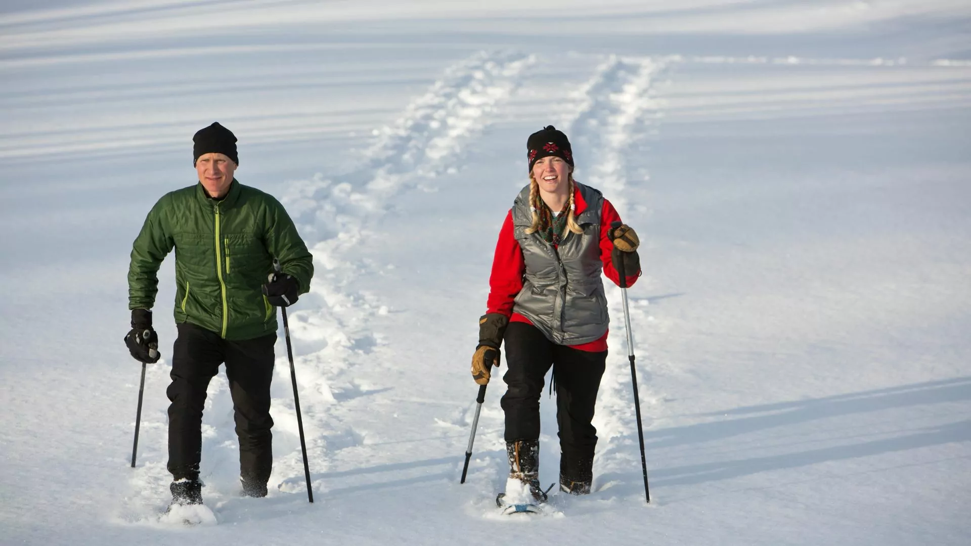 Two people snowshoe in Alaska
