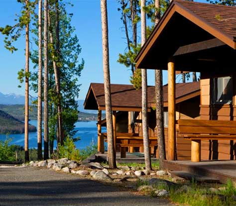 Grand Lake Lodge cabins with the blue water of Grand Lake in the background