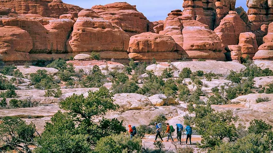 Hikers in Chesler Park, Canyonlands National Park