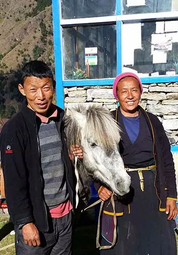 Nepalese couple with donkey in Langtang Valley