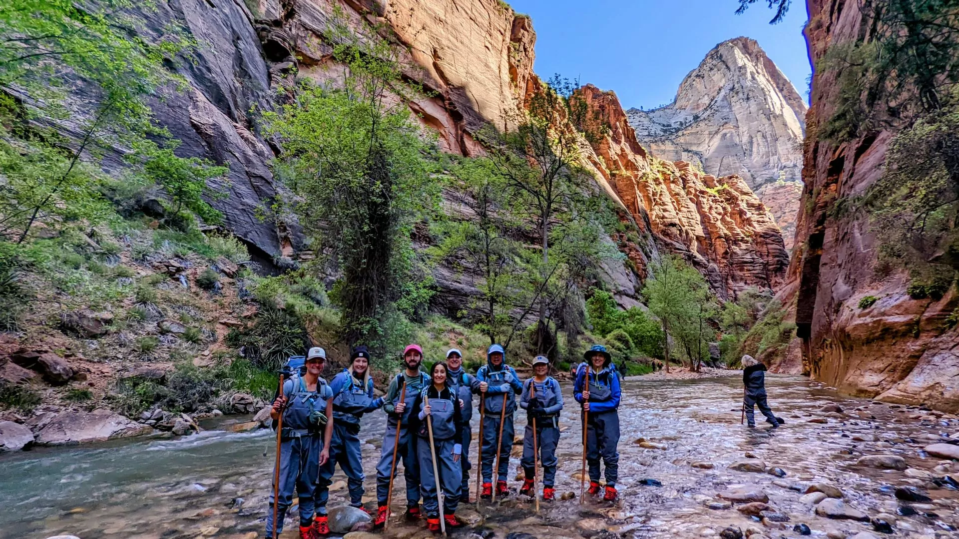 Hikers wearing waders stand ready to begin the Zion Narrows hike
