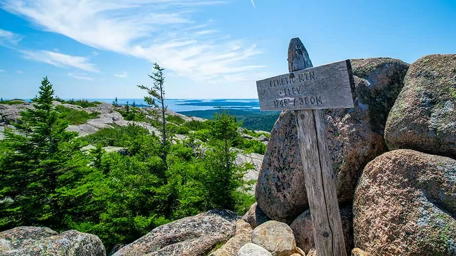 The rocky summit of Pemetic mountain in Maine on a sunny day in the summer