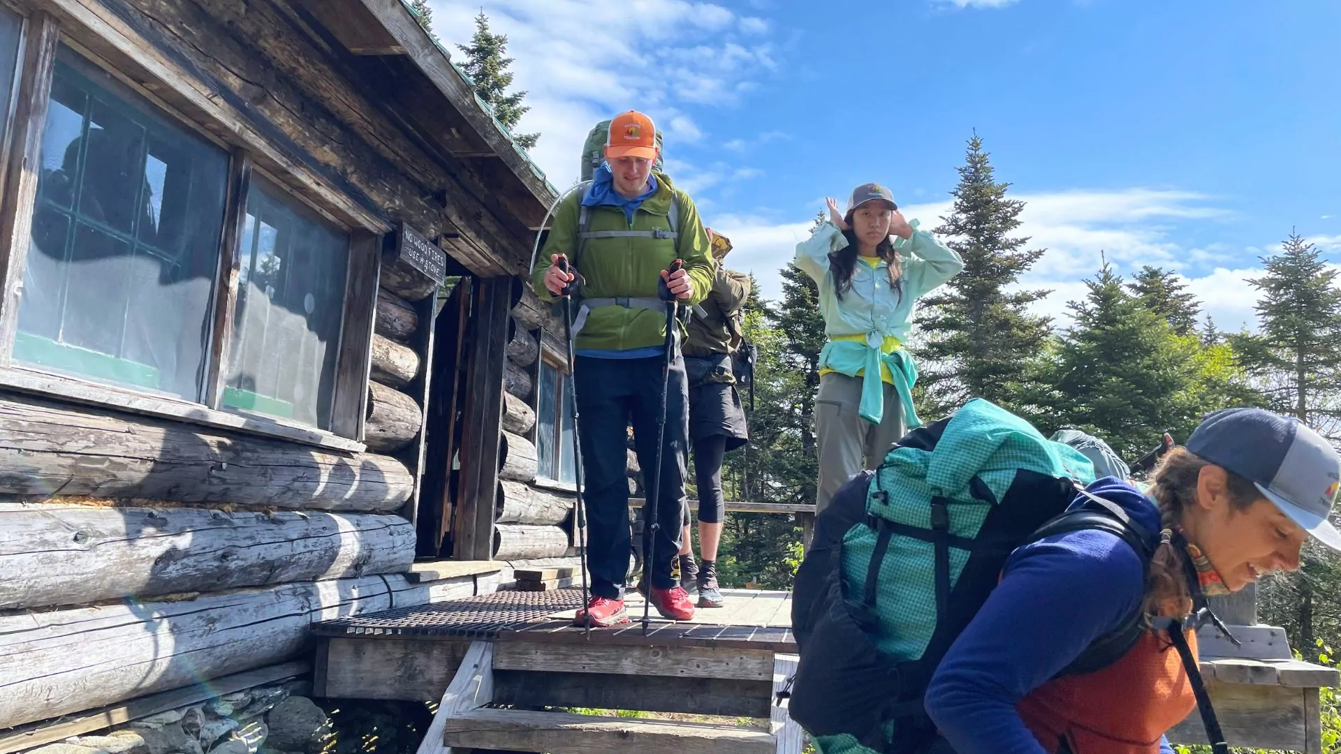 Hikers head out of an AMC hut to hit the trails