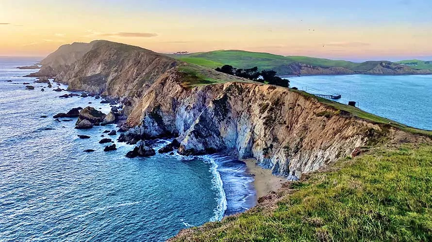 Photo of Point Reyes National Seashore from Chimney Rock trail at sunset in the winter of 2021.