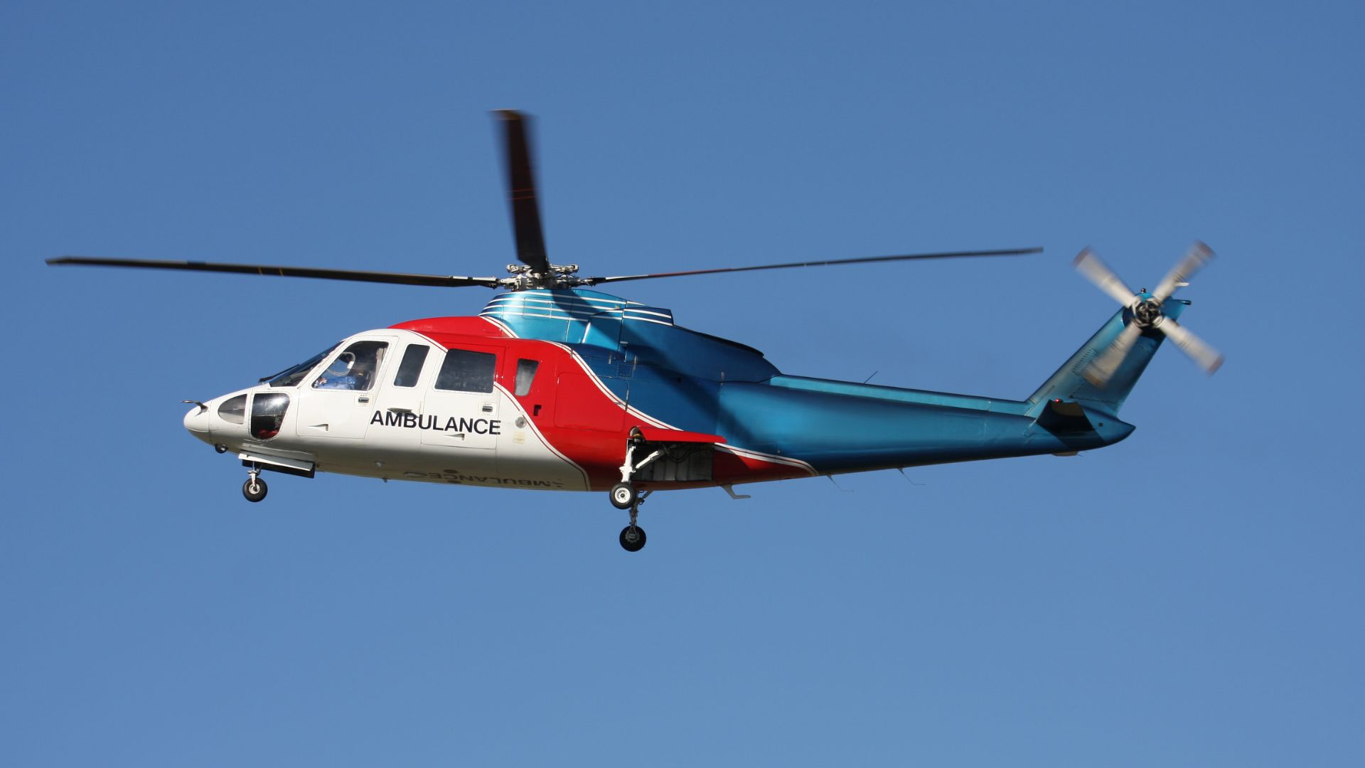 A medevac helicopter flies overhead