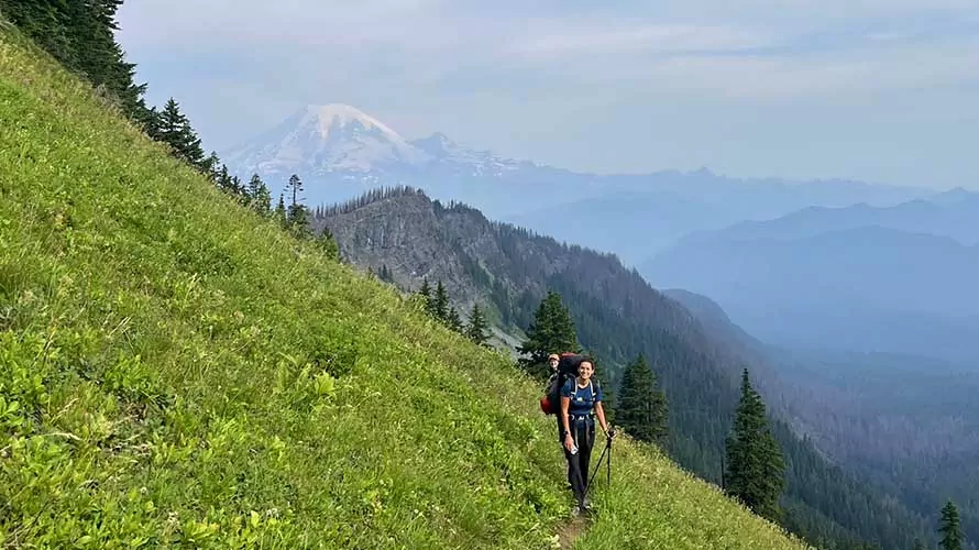 Backpackers in side slope meadow in the Goat Rocks, Cascades