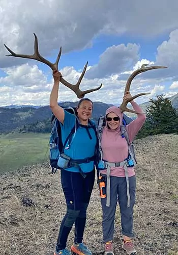 2 women hikers with antlers in Wyoming
