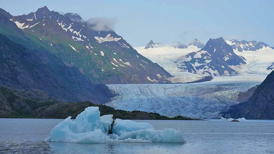 Glacier in Alaska emptying into a mountain lake