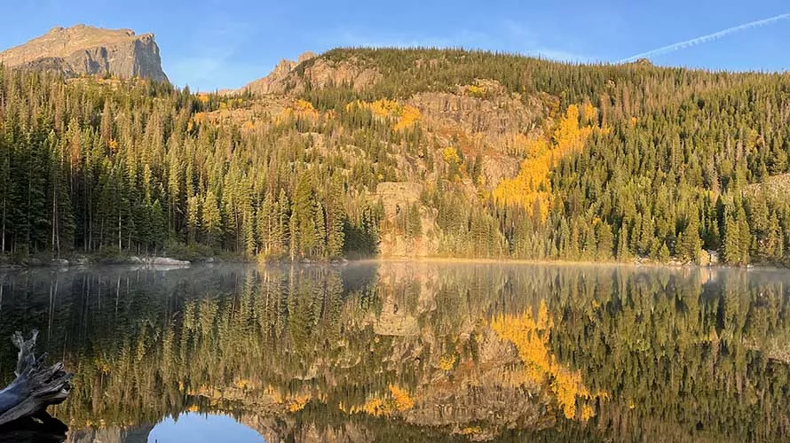 Fall colors in full display at a lake in Rocky Mountain National Park