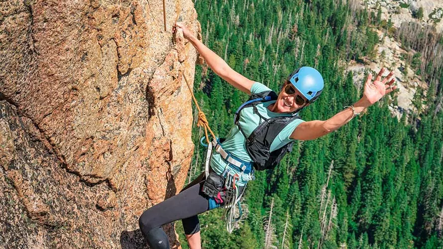 Woman rock climbing on Fresno Dome, California