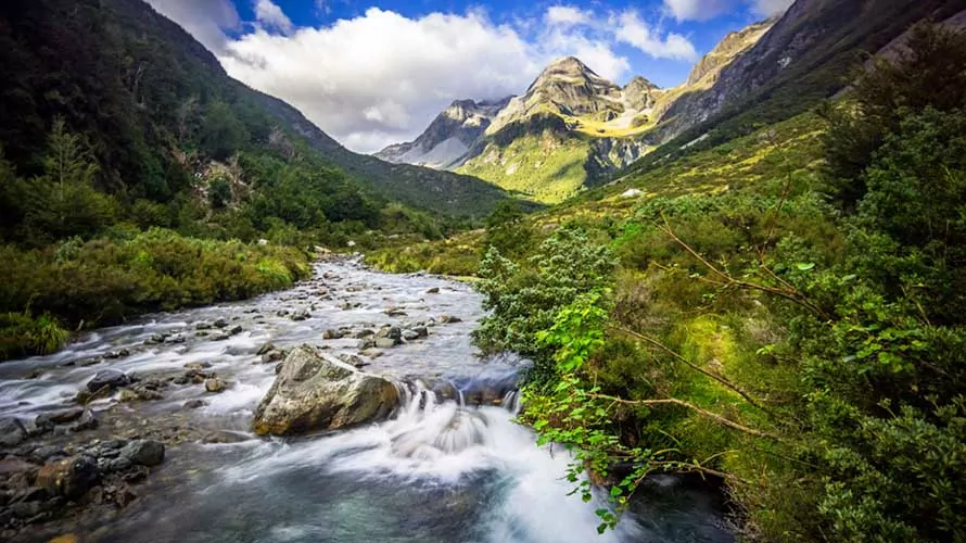 Mountain river flowing down from peaks in the New Zealand