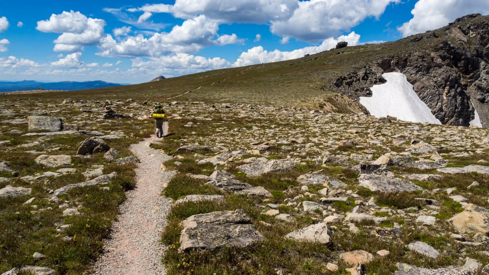 A backpacker follows the continental divide trail in rocky mountain national park