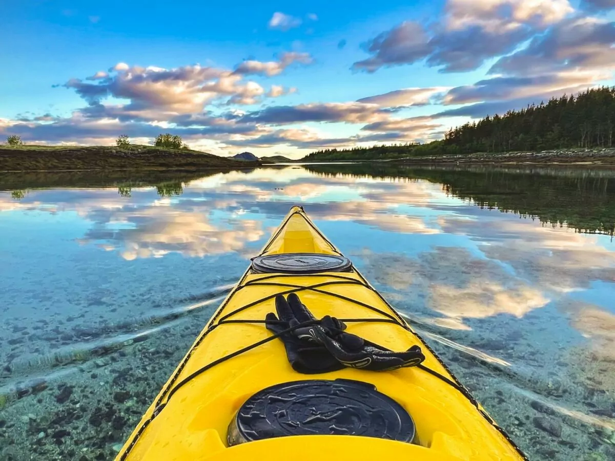 A kayak points into the sunset