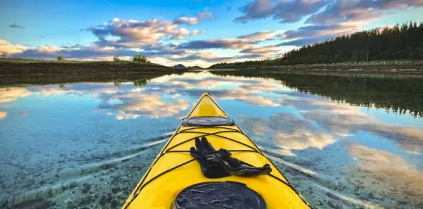 A kayak points into the sunset