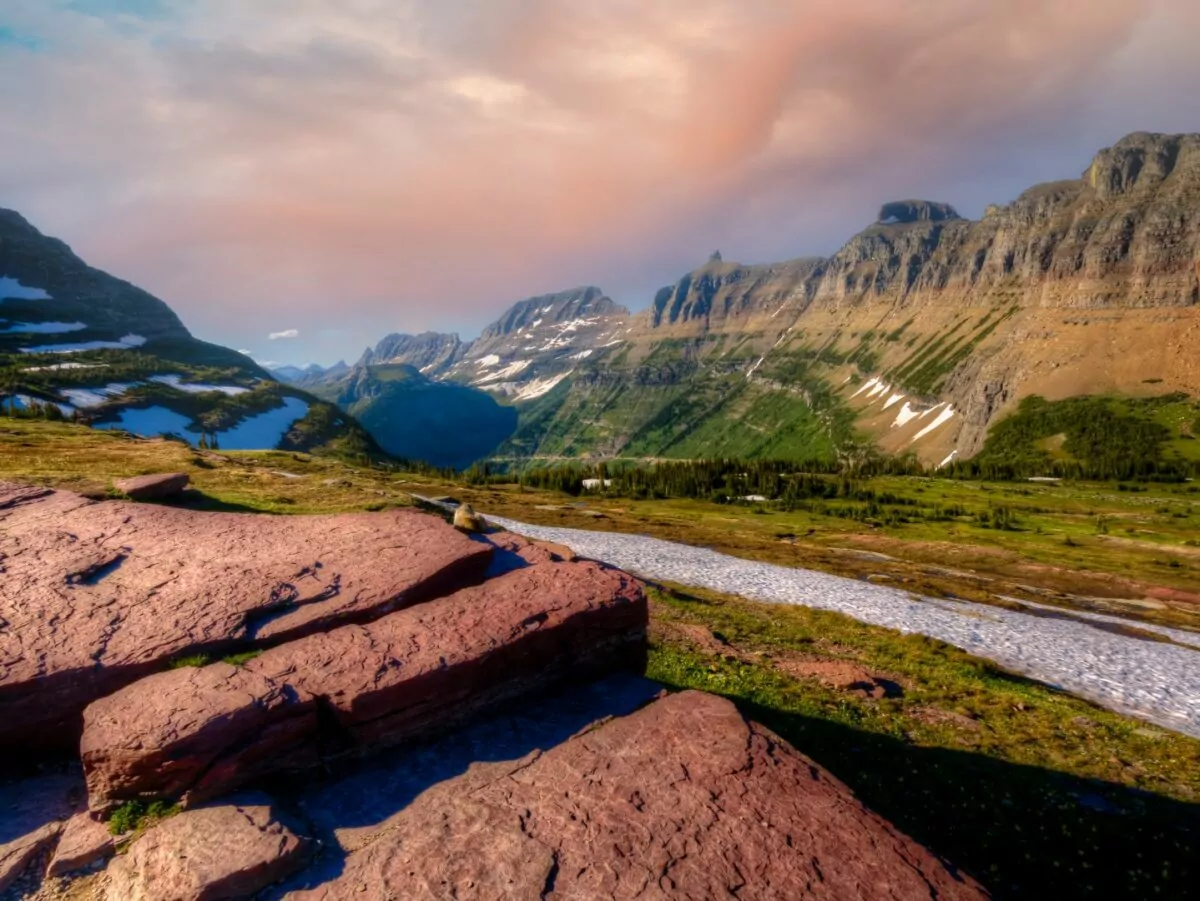 Mountains and a river mark the US continental divide in Glacier National Park