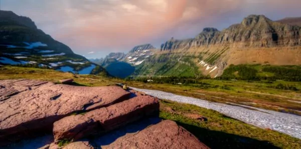 Mountains and a river mark the US continental divide in Glacier National Park