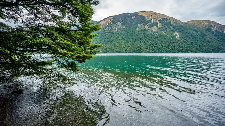 Beautiful lake with alpine peaks behind in the South Island of New Zealand