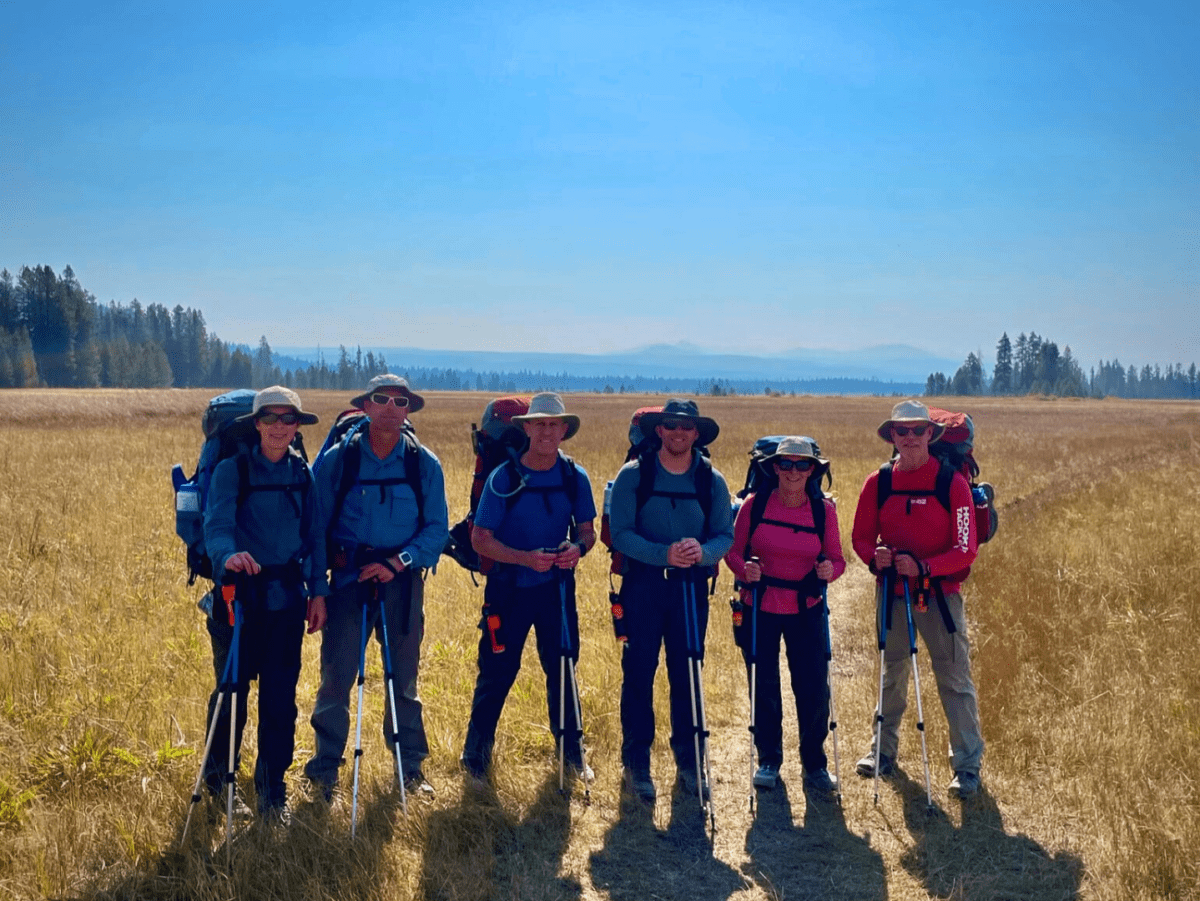 A group of backpackers pose in Yellowstone
