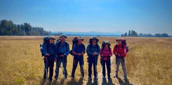 A group of backpackers pose in Yellowstone