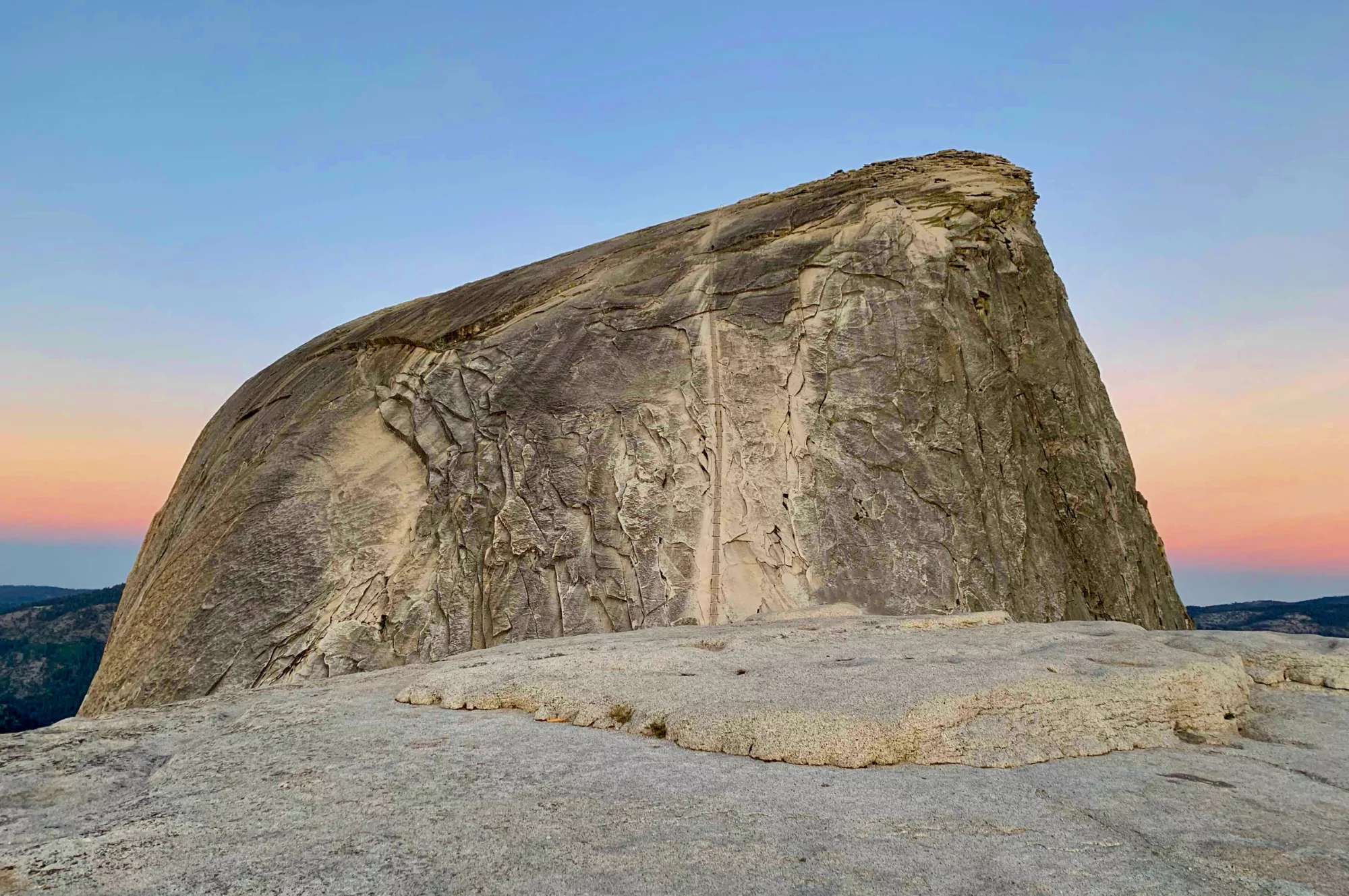 Yosemite's half dome cables section looms up at sunrise