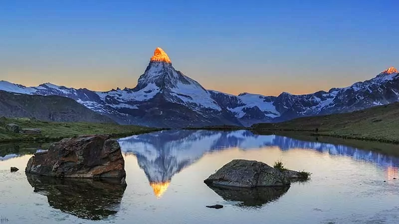 Matterhorn at sunrise with an alpine lake in the foreground, Switzerland