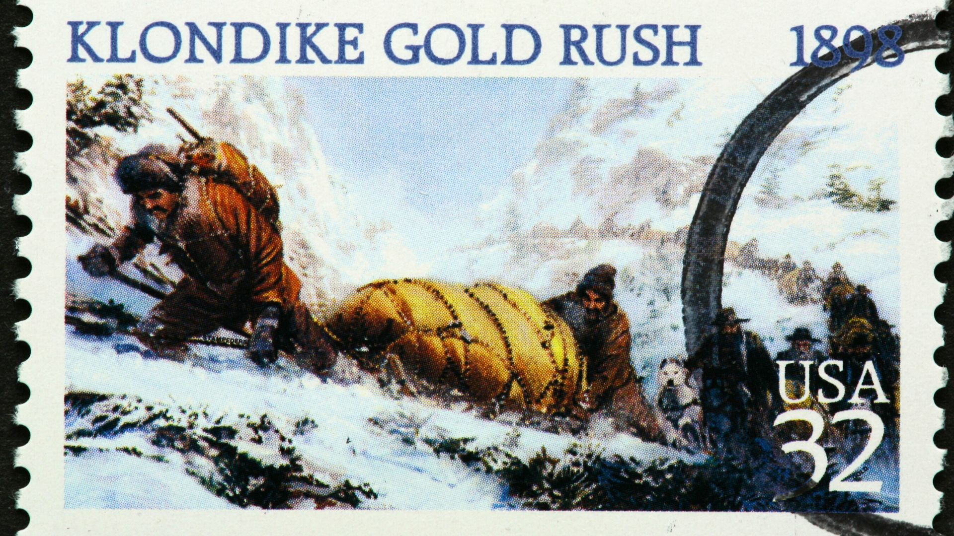 A stamp commemorating the Klondike gold rush depicts prospectors in Alaska