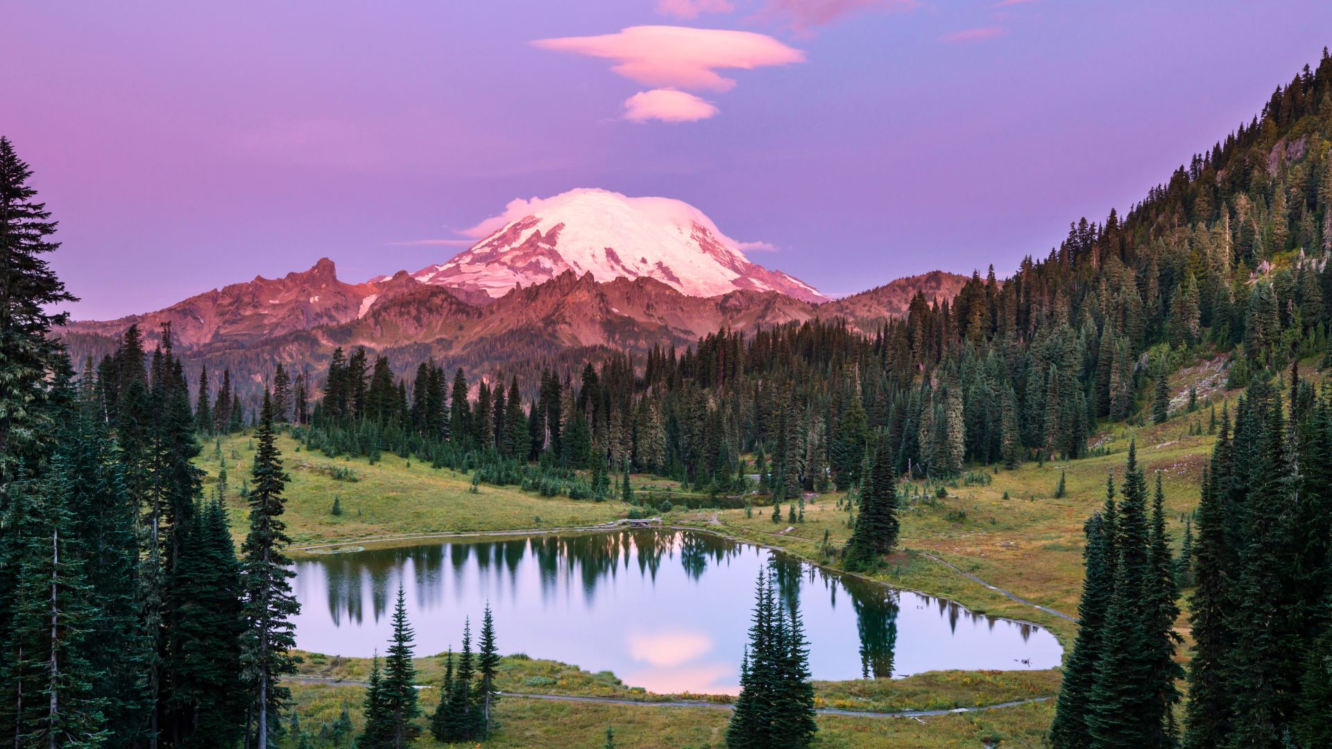 Mount Rainier reflects in a lake in Washington's Rainier National Park