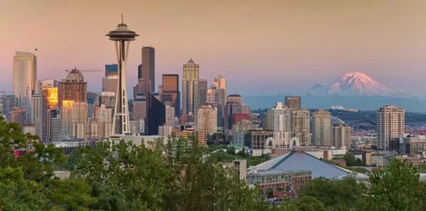 Mount Rainier peaks out behind the Seattle skyline
