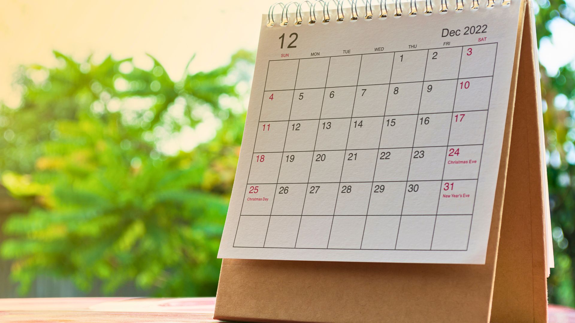 A desktop calendar shows the month of December