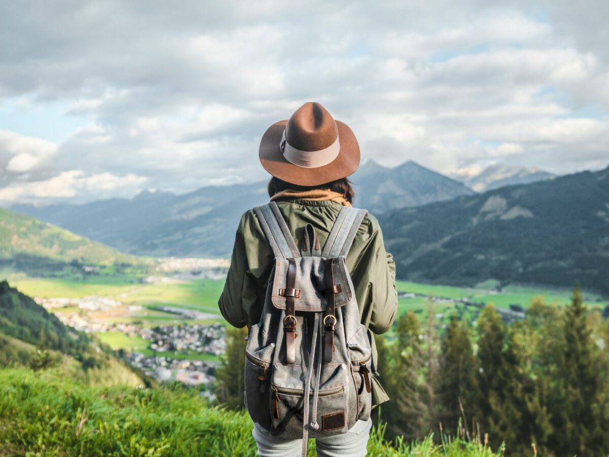 A woman traveling alone looks into the distance