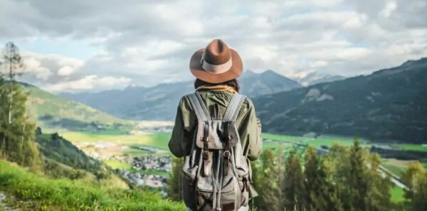 A woman traveling alone looks into the distance