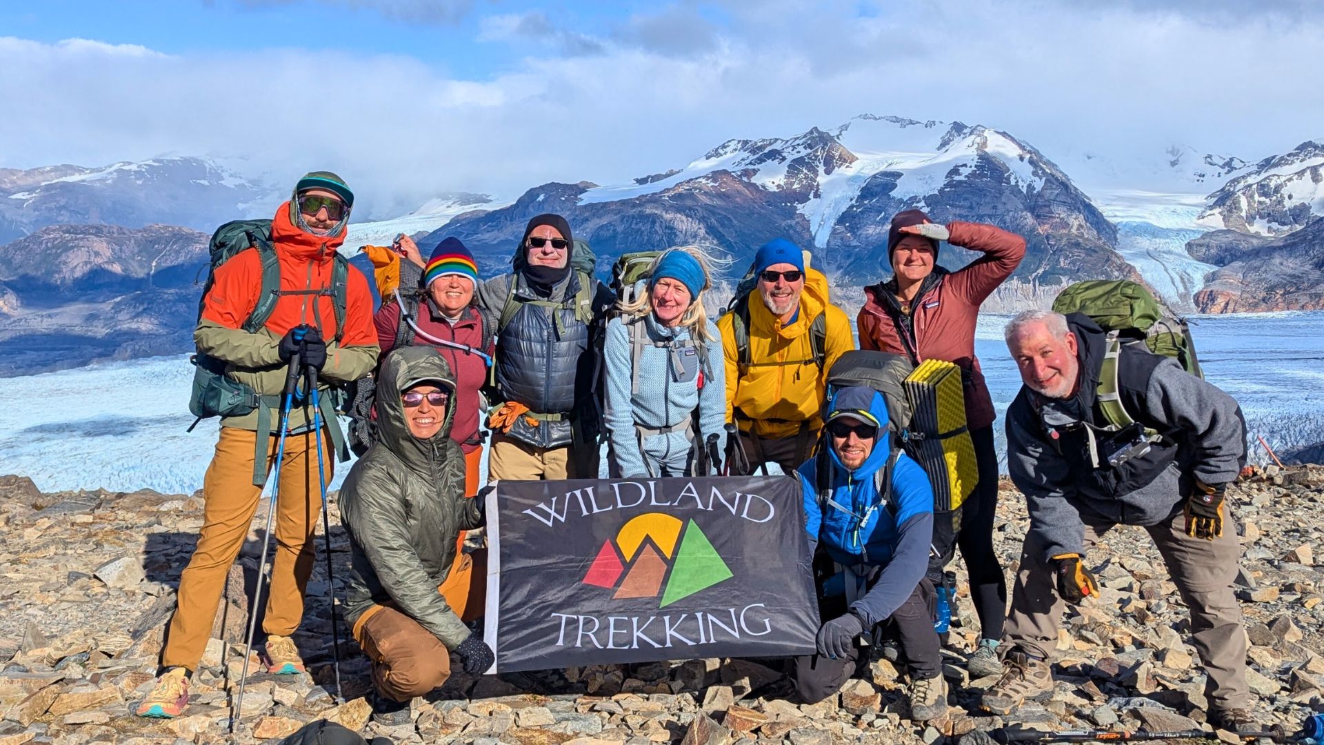 A tour group with Wildland Trekking poses together in Patagonia