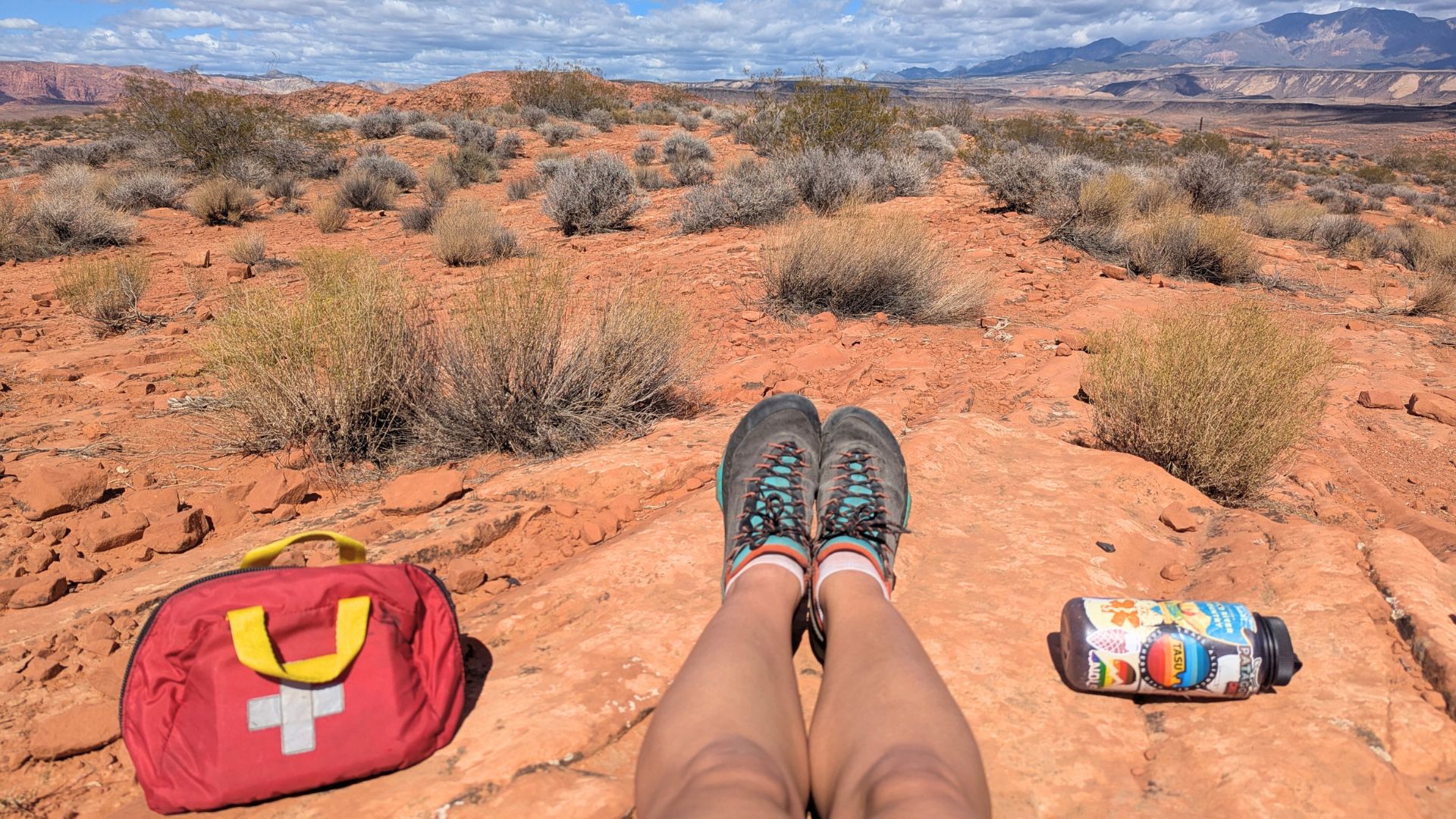 First aid kit, water bottle and hiking shoes