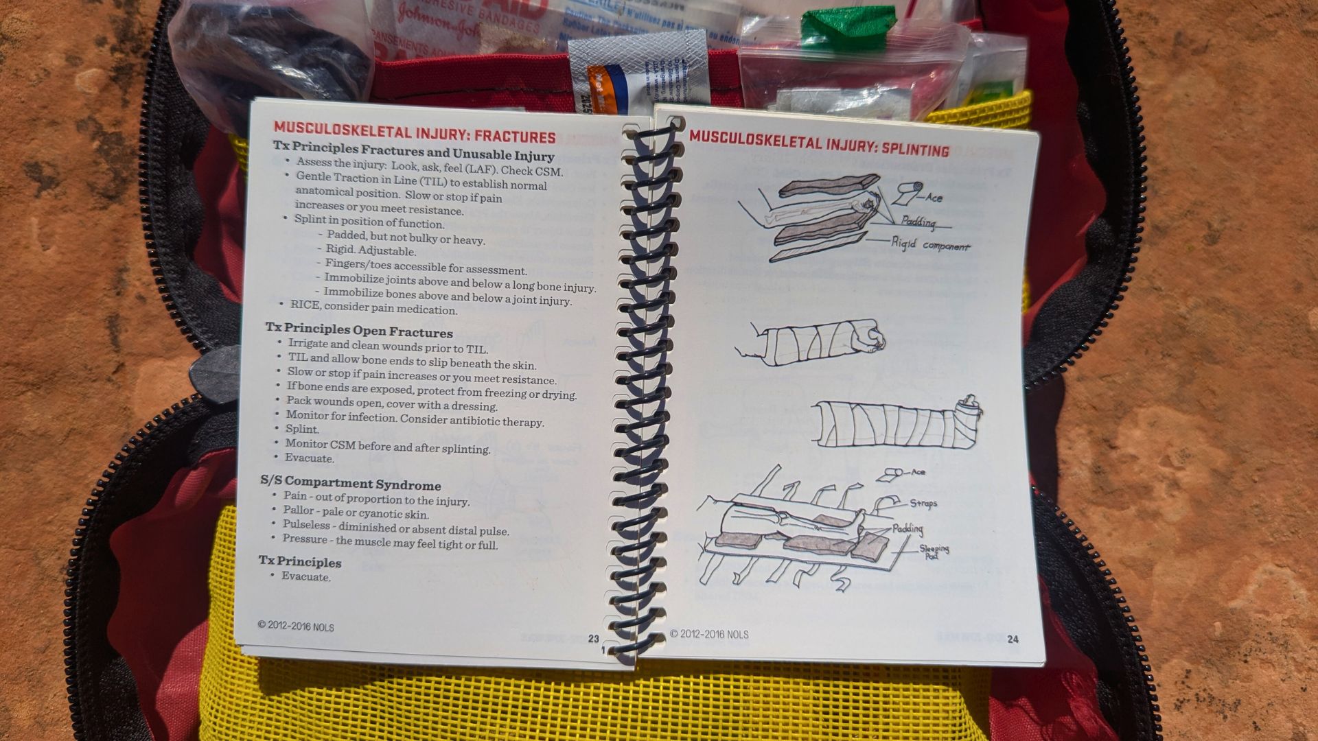 An open medical text details the treatment of musculoskeletal injuries