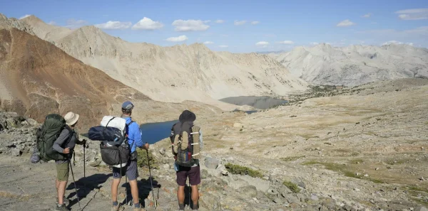Three backpackers look at the mountains|Backpacking food|A guide cooks backpacking food|Tortillas|Instant oatmeal||Snack mix|Trail mix|Ramen
