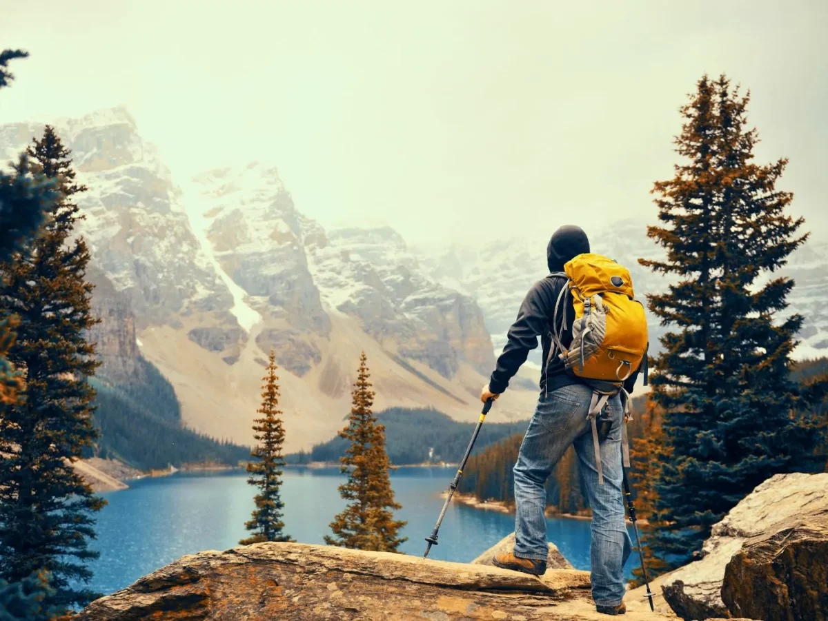 A hiker looks out on Banff National Park in the Canadian Rockies||Johnston Canyon trail in Banff National Park|Lake Louise lakeshore in Banff National Park