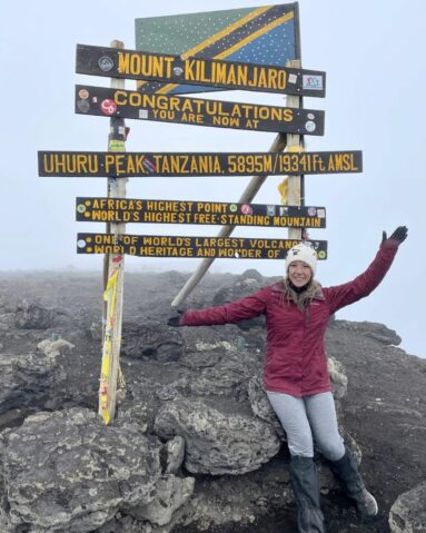 Hiker on the summit of Mt Kilimanjaro