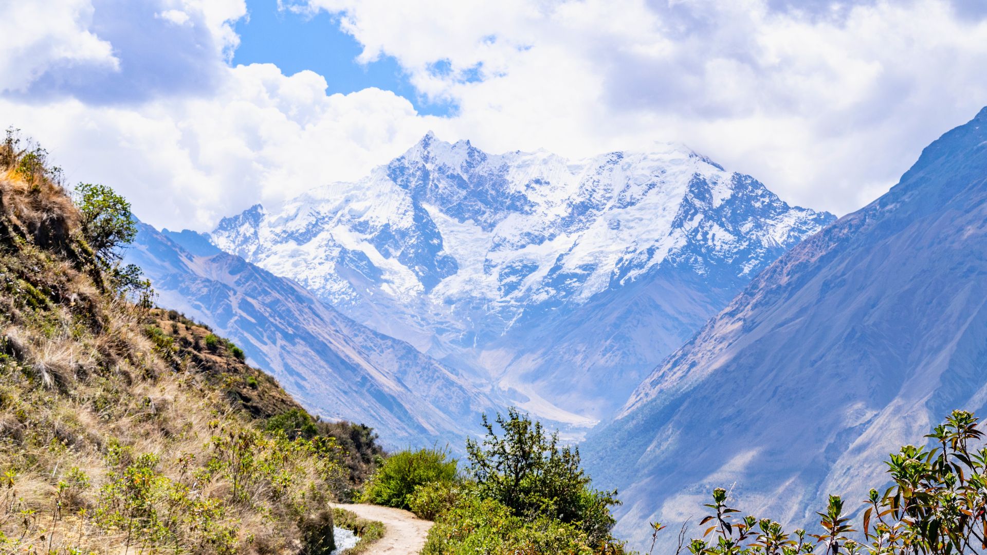Salkantay trail winds past Salkantay Mountain in Peru
