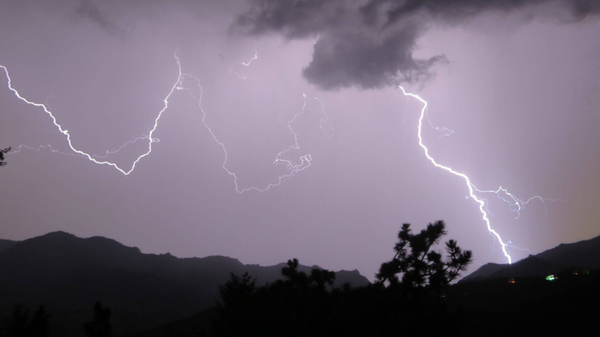 Lightning strikes over the mountains