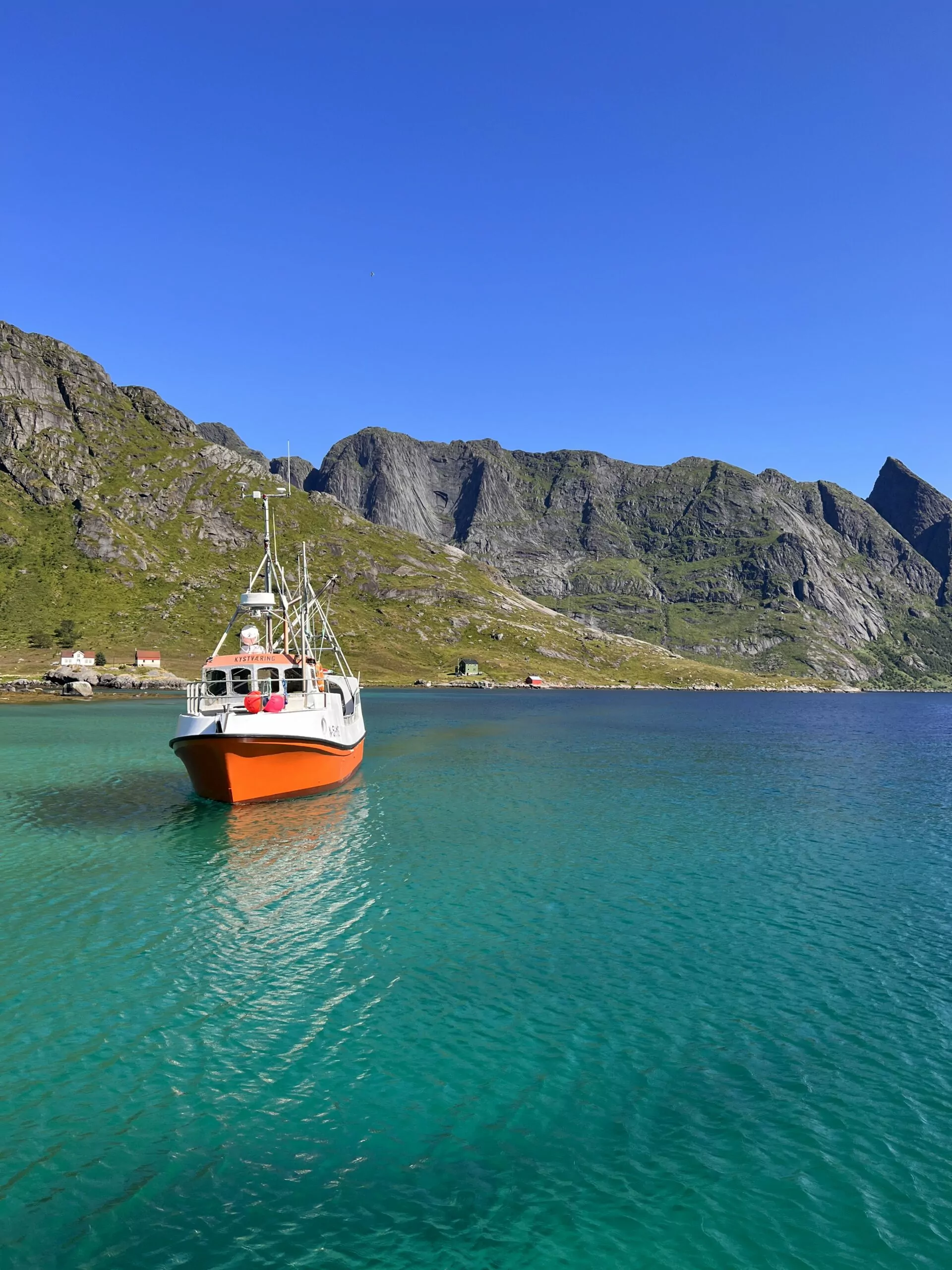 Ferry boat to Lofoten Island Hike in clear waters