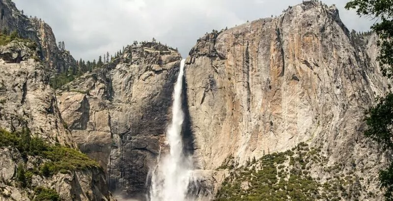 Massive waterfall in Yosemite National Park granite hiking backpacking guiding trips