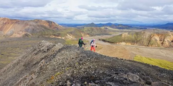 Hikers on rocky landscape in Iceland