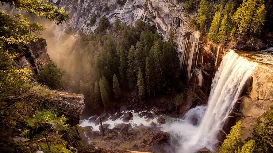 Mountain waterfall in golden light