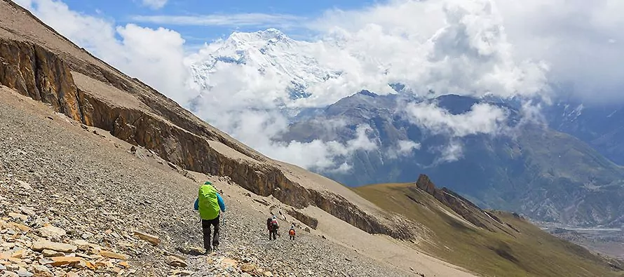 Hiker on side of rocky mountain