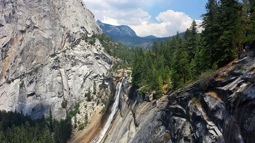 Distant waterfall amid rocky mountains