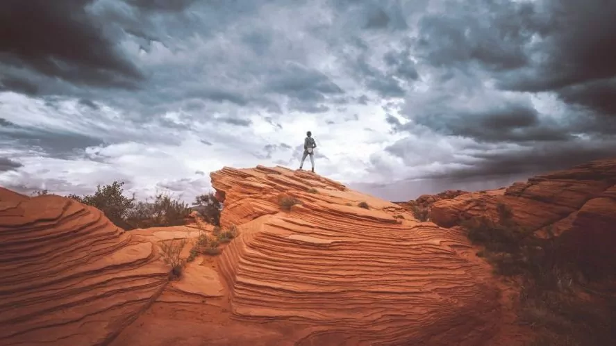 Woman standing on cliff