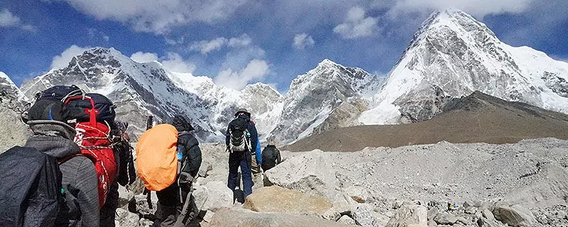 Hikers on rocky alpine trail