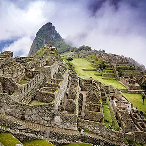 Machu Picchu rises above the cloud coverage in the Peruvian mountains
